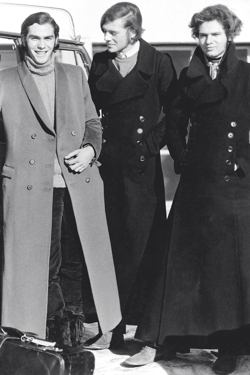 Three students from Le Rosey wearing coats acquired from London, 1971 (Photo by Mary Russell/Condé Nast via Getty Images)