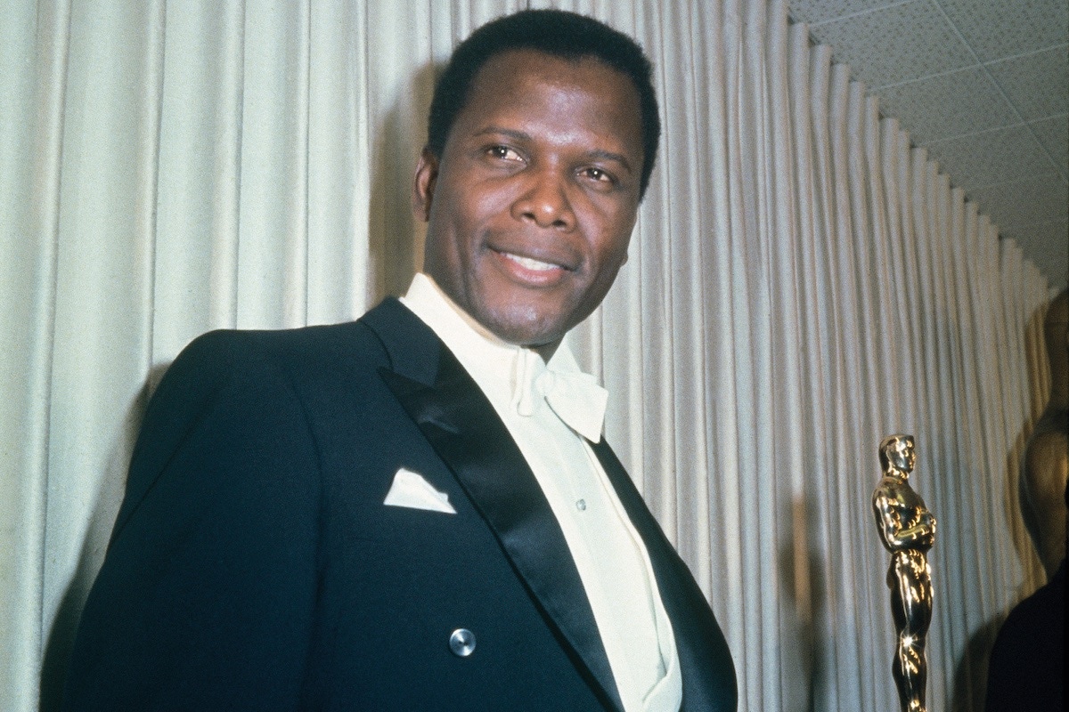 Bahamian American actor Sidney Poitier holding his Academy Award for Best Actor in a Leading Role for 'Lilies Of The Field', directed by Ralph Nelson, at the 36th Academy Awards ceremony, 13th April 1964. The ceremony was held at the Santa Monica Civic Auditorium, Santa Monica, California. (Photo by Archive Photos/Getty Images)