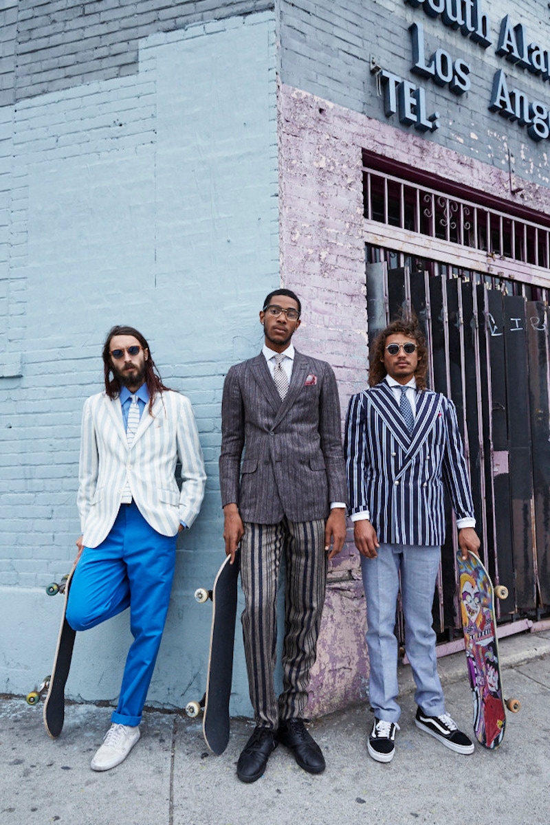 From left: Sky blue and ecru striped wool-flannel blazer, Hackett; blue cotton trousers, Richard James; sky blue linen shirt, Emma Willis, Grey-blue knitted silk tie, Hackett. White canvas trainers, Vans, property of the skater.  Charcoal silk-linen-wool fine-striped sport coat and trousers, white striped cotton shirt, both Ermenegildo Zegna Couture; burgundy and white gingham-check silk tie, Dunhill, black and gold eye-frames; Dita. Brown linen pocket-handkerchief with dusty pink-red rolled edge, Dunhill, property of The Rake. Bespoke navy striped cotton boating blazer, Sciamat; pale blue cotton-linen-silk herringbone trousers, Hardy Amies; white cotton shirt, Chester Barrie; navy checked linen tie, Hackett; navy suede trainers, Vans, property of the skater. Sunglasses, property of the skater; Fuschia-pink linen pocket-handkerchief, property of The Rake.