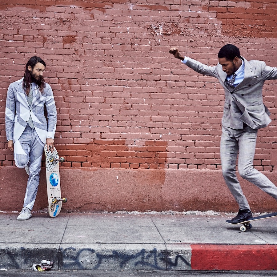 From Left: Black and white Prince-of-Wales check wave-print cotton suit, Alexander McQueen; pale-grey cotton shirt, Caruso; grey silk tie, Ralph Lauren Purple Label; white canvas trainers, Vans, property of the skater. Black, burgundy and ivory check lightweight wool suit, Valentino; white linen shirt, Alfred Dunhill; purple checked silk tie, Hackett; navy canvas trainers, property of the skater.