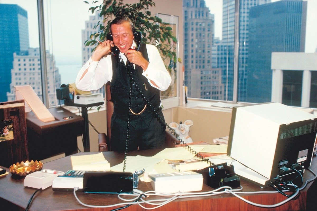 Ivan Boesky taking two calls at once in his New York office, 1977 (Photo by John Marmaras/Woodfin Camp/Woodfin Camp/The LIFE Images Collection/Getty Images)