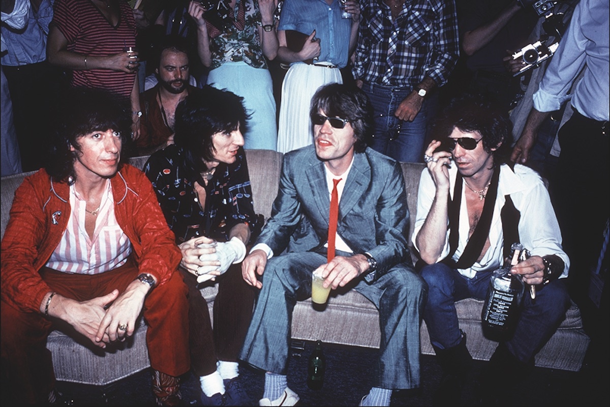 From left, British musicians Bill Wyman, Ron Wood, Mick Jagger, and Keith Richards sit on a couch at Danceteria, New York, New York, June 26, 1980. The band was there to promote their album 'Emotional Rescue'. (Photo by Allan Tannenbaum/Getty Images)