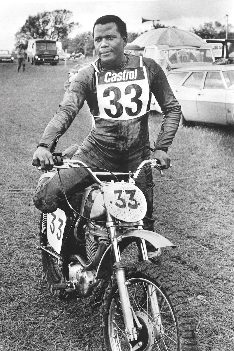 Sidney Poitier, preparing for a scene on a motorcycle, 1973.