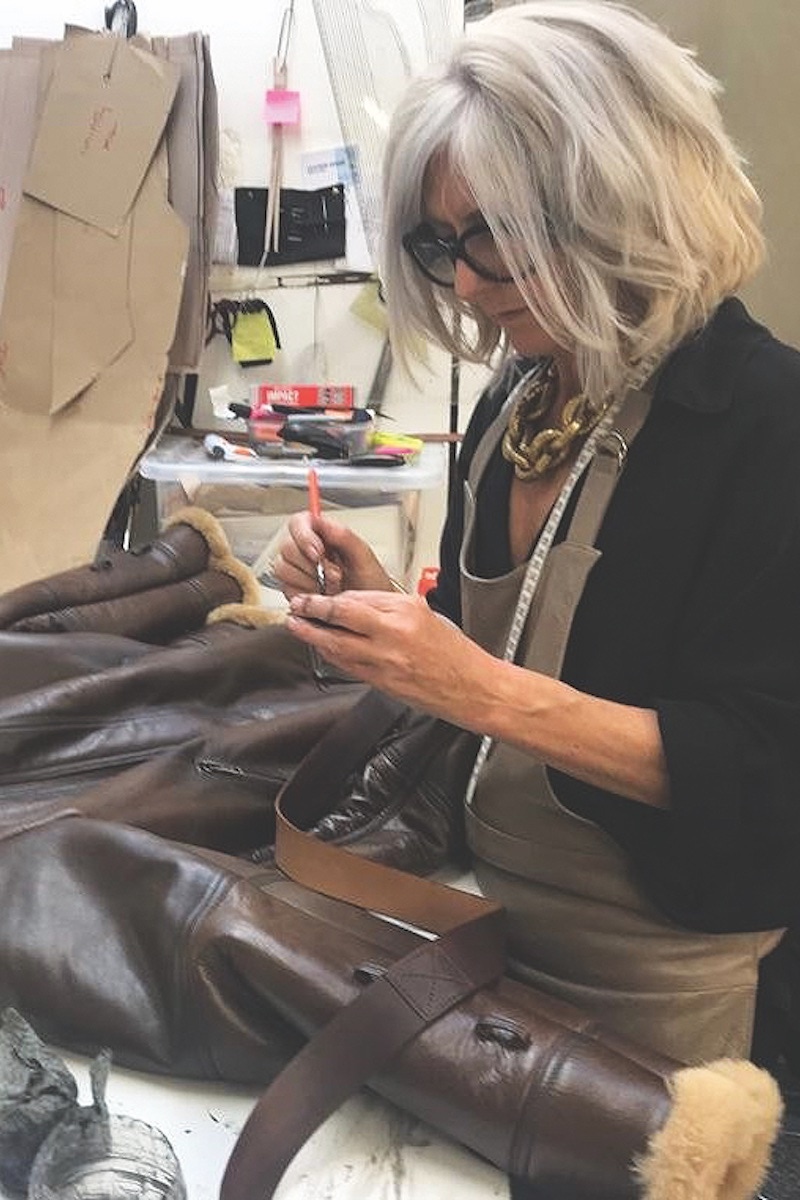 Pauline Harris, the Director and chief leather jacket tailor, at work on a bomber jacket