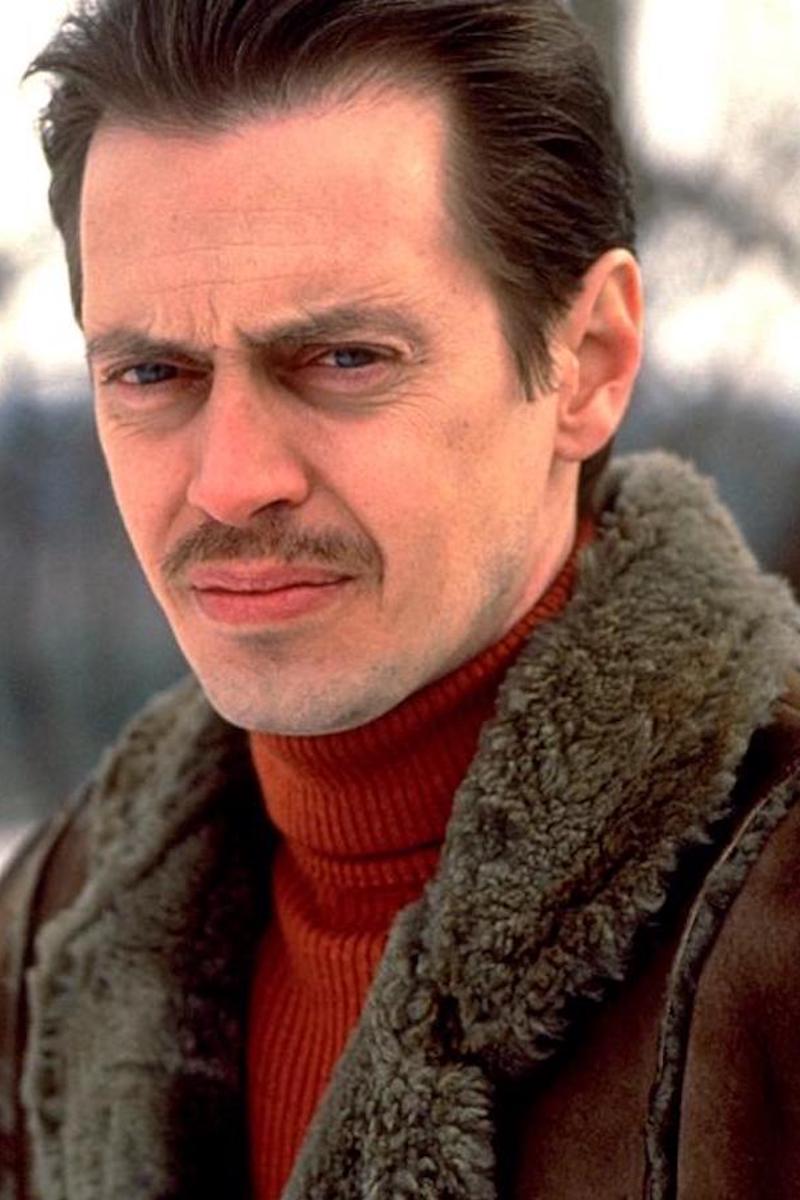 Channel Steve Buscemi as Carl Showalter in Fargo (1996) by pairing a dark brown shearling jacket with a deep red ribbed knit.