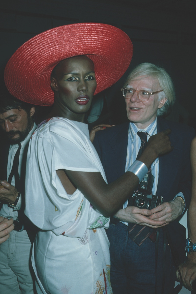 Grace Jones and Andy Warhol attend the premiere party for 