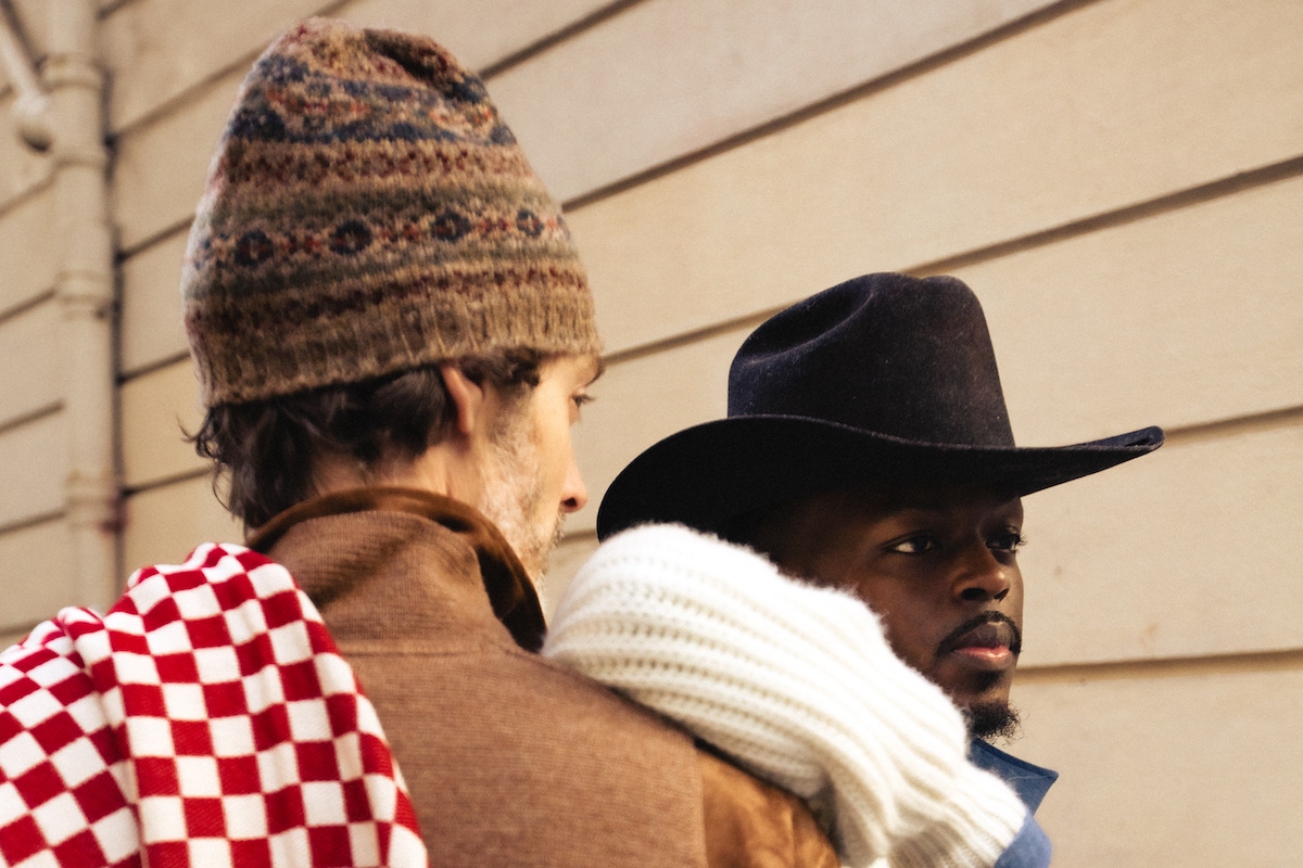 Kevis wears: blue cotton denim shirt, Lorenzo Cifonelli for The Rake; white shawl cardigan, Anderson & Sheppard; hat, denim and boots, models own.