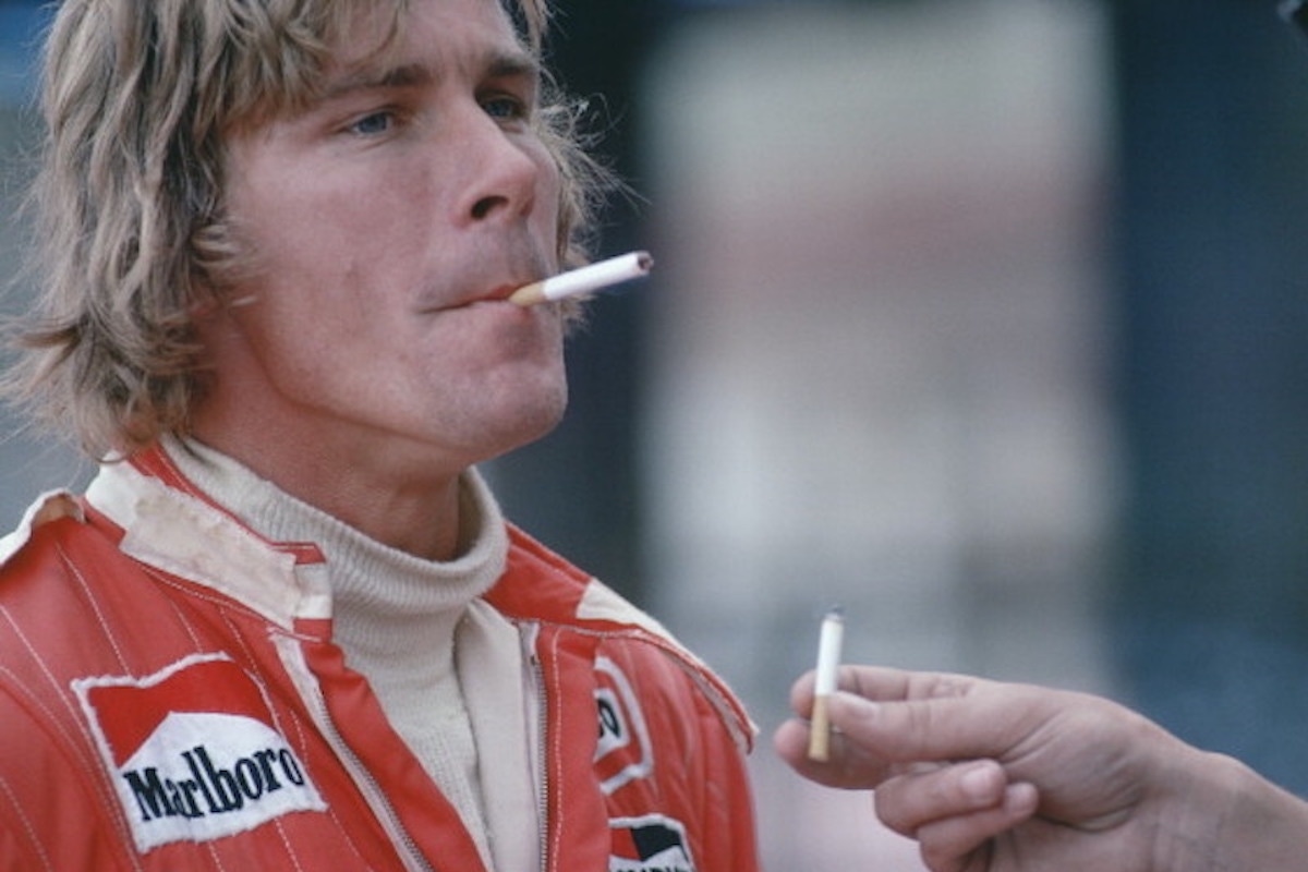 James Hunt driver of the #11 Marlboro Team McLaren McLaren M23 Ford Cosworth DFV with a cigarette before the start of the Grand Prix of Monaco , 1976. (Photo by Rainer W. Schlegelmilch/Getty Images)