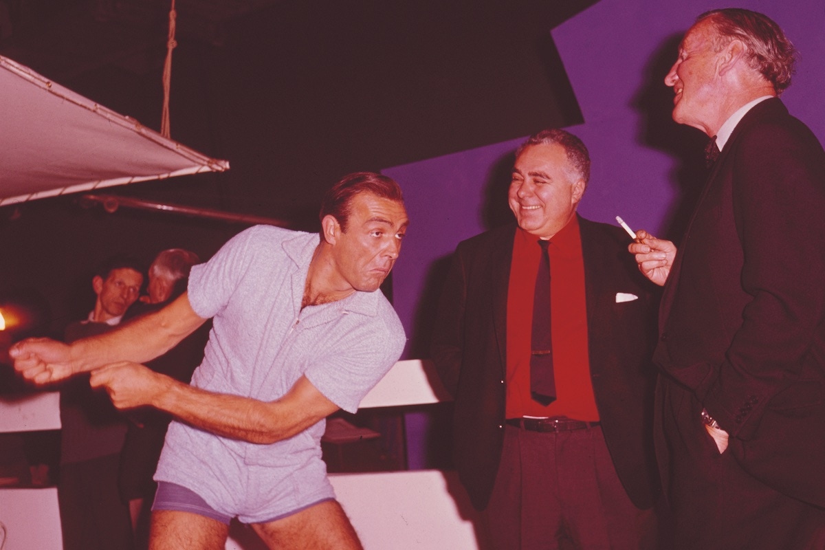 Fleming with Sean Connery and producer Harry Saltzman on the set of Goldfinger at Pinewood Studios in April 1964. (Photo by Popperfoto via Getty Images/Getty Images)