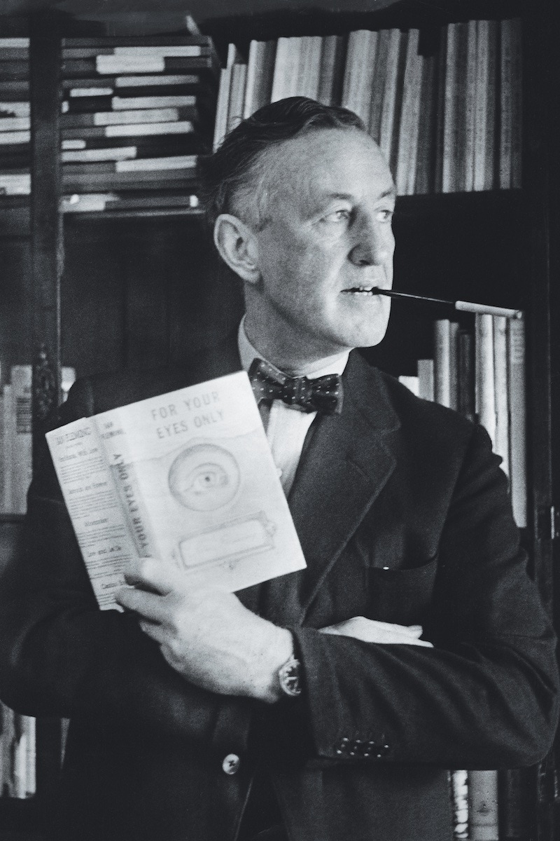 Posing with a copy of For Your Eyes Only. (Photo by � Hulton-Deutsch Collection/CORBIS/Corbis via Getty Images)